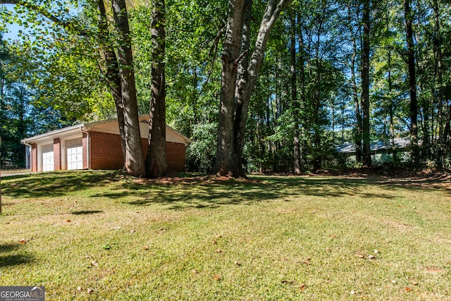 view of yard with a garage