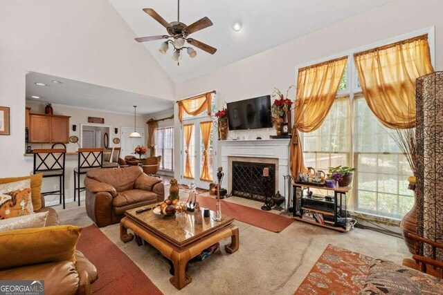 living room featuring carpet flooring, high vaulted ceiling, and ceiling fan