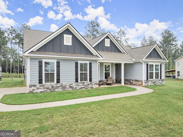 craftsman-style home with a front yard