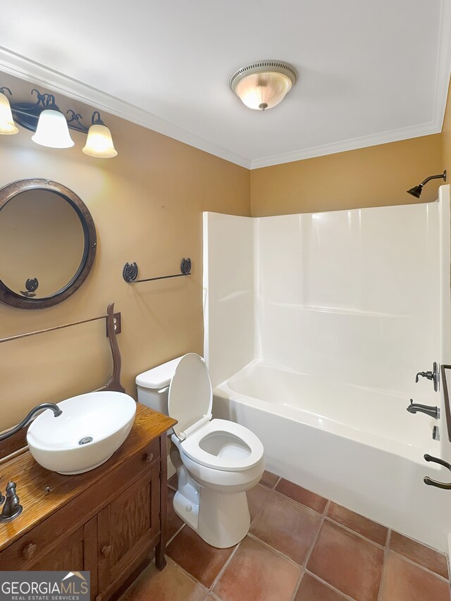 full bathroom featuring vanity, crown molding, toilet,  shower combination, and tile patterned floors