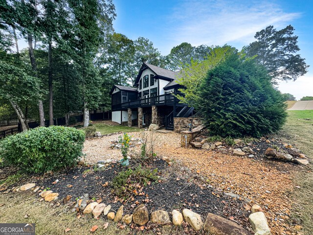 view of yard featuring a wooden deck