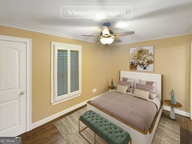 bedroom with ceiling fan, dark hardwood / wood-style floors, and crown molding