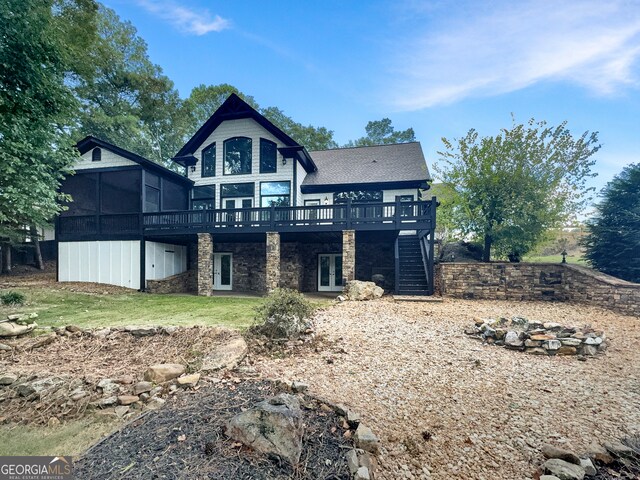 back of house featuring a wooden deck