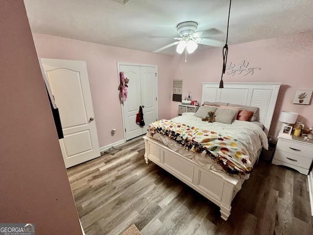 bedroom featuring ceiling fan and hardwood / wood-style floors