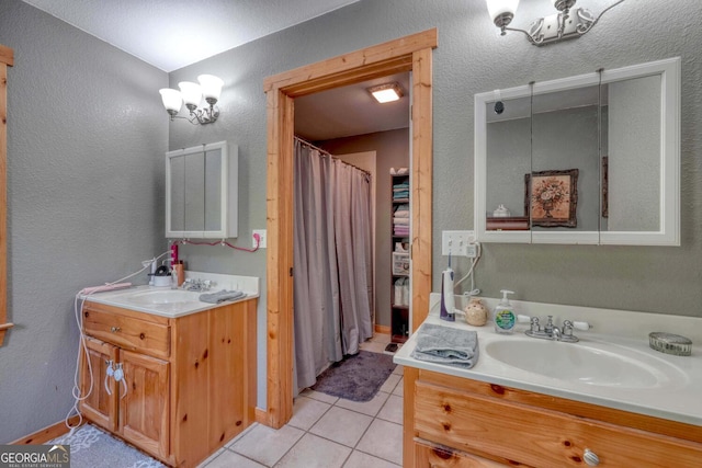 bathroom with tile patterned floors and vanity