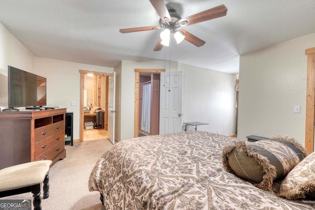 carpeted bedroom with a textured ceiling and ceiling fan