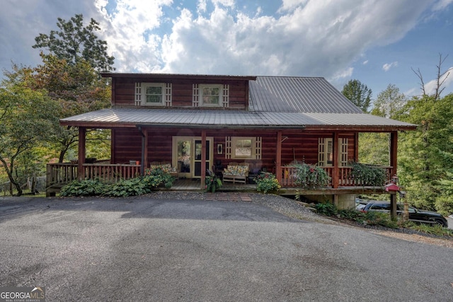 cabin featuring covered porch