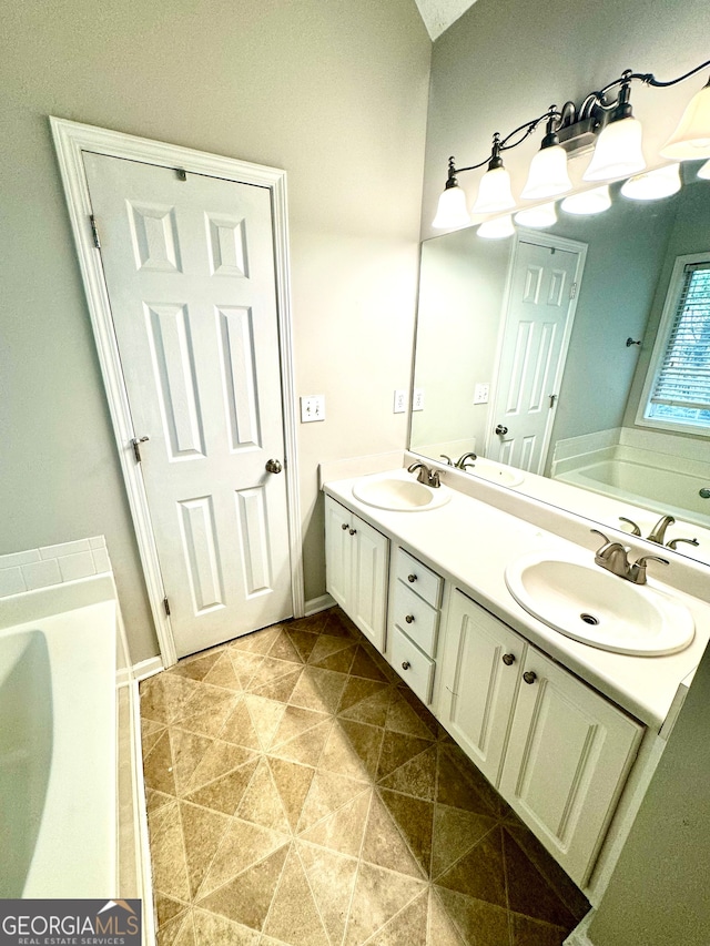 bathroom featuring a bath and vanity