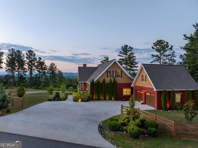 view of front of home featuring a yard and a garage