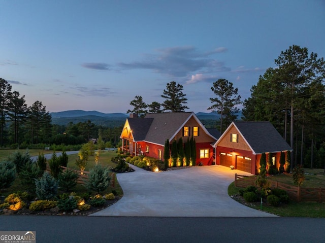 view of front of house featuring a mountain view and a garage