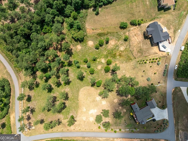 birds eye view of property featuring a rural view