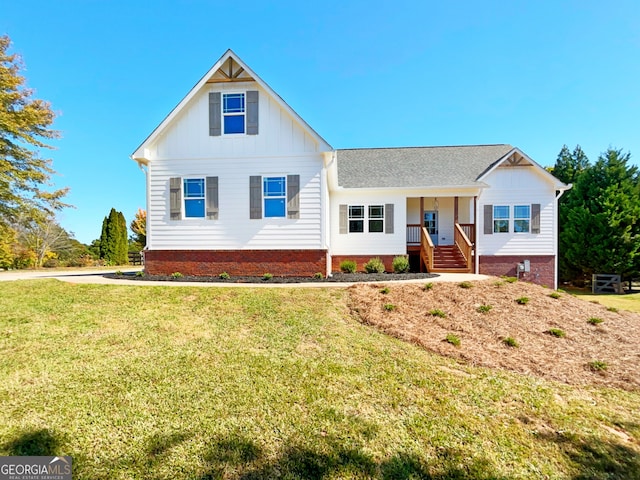 view of front of home featuring a porch and a front lawn