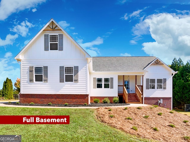 view of front of house featuring board and batten siding and a front lawn