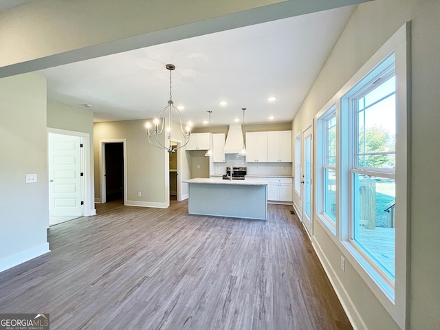 kitchen with baseboards, white cabinets, stainless steel electric range oven, dark wood-style flooring, and custom exhaust hood