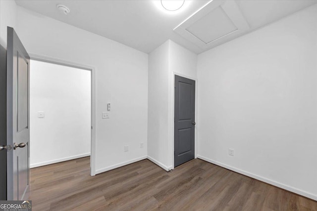 empty room with dark wood-type flooring