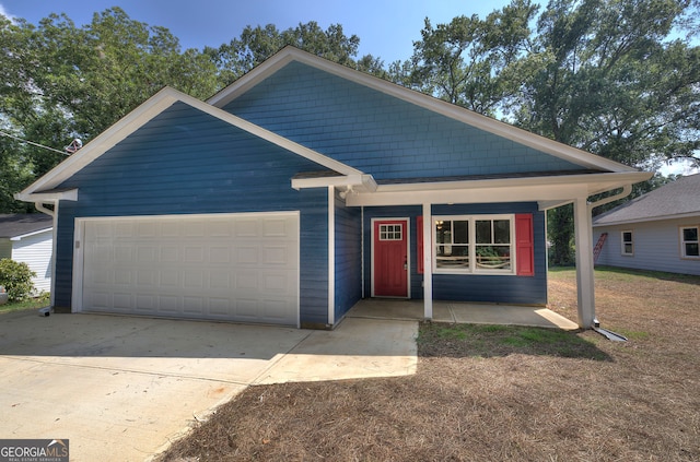 view of front of house featuring covered porch and a garage