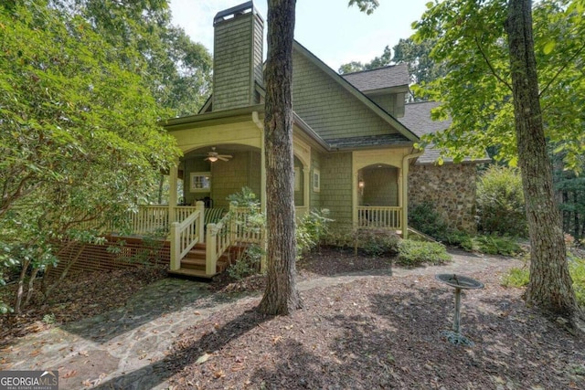 back of property with covered porch