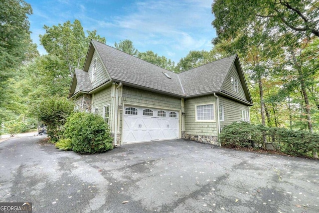 view of side of property featuring a garage