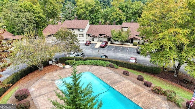view of swimming pool with a fenced in pool