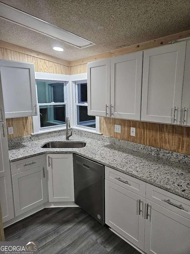 kitchen featuring white cabinetry, dishwasher, dark wood-type flooring, and sink