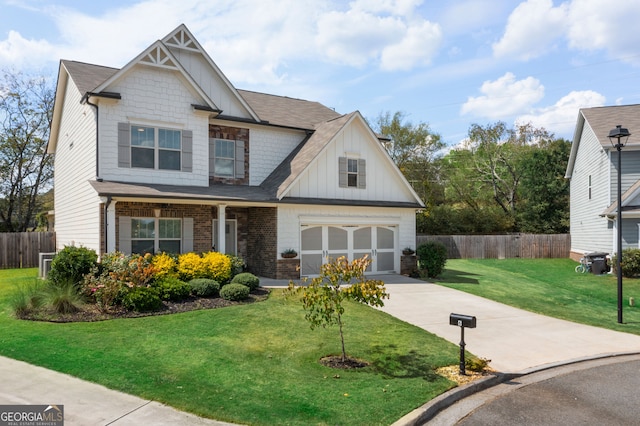 craftsman inspired home featuring a garage and a front lawn