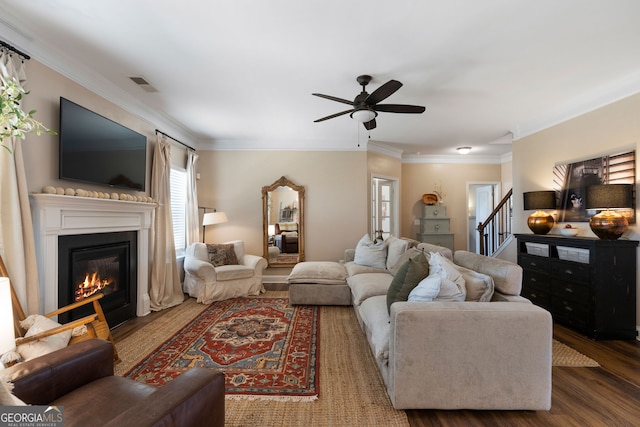 living room with ceiling fan, crown molding, and dark hardwood / wood-style flooring