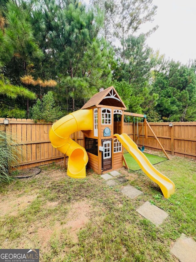 view of play area with a yard