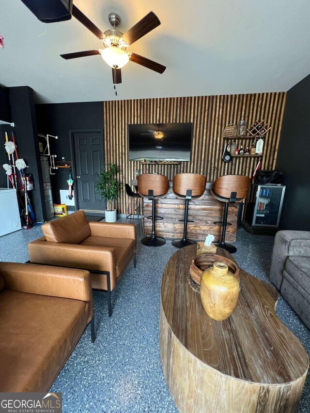 living room featuring ceiling fan and water heater