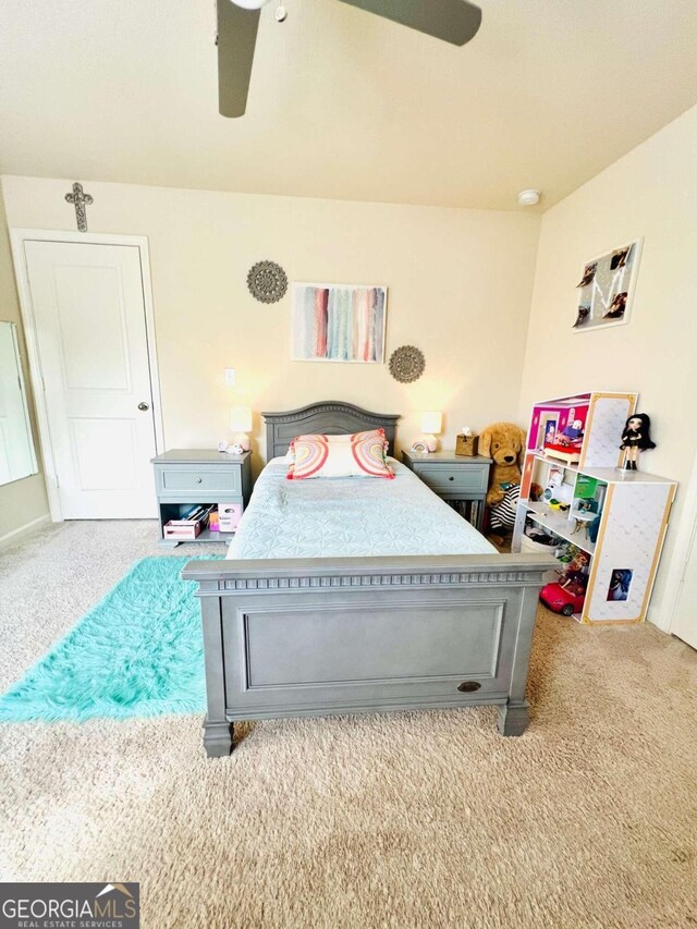 bedroom featuring light carpet and ceiling fan