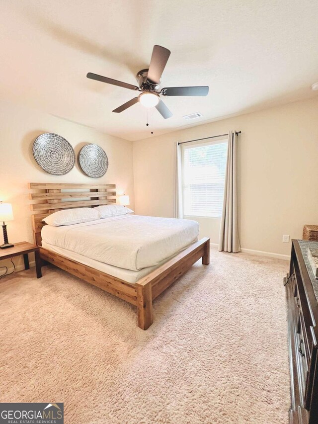 carpeted bedroom featuring ceiling fan