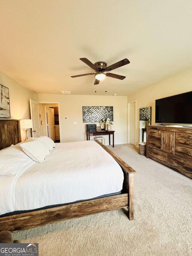 carpeted bedroom featuring ceiling fan