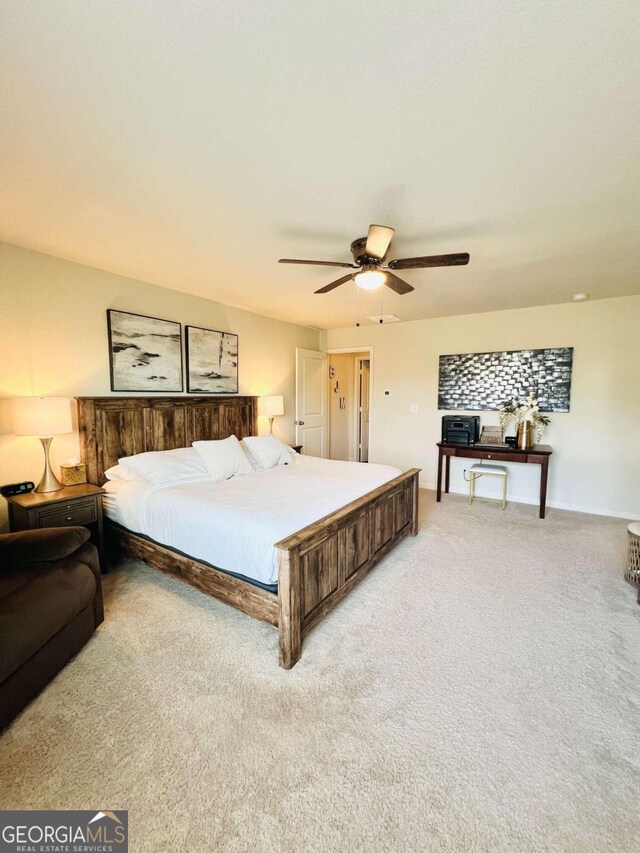 carpeted bedroom featuring ceiling fan