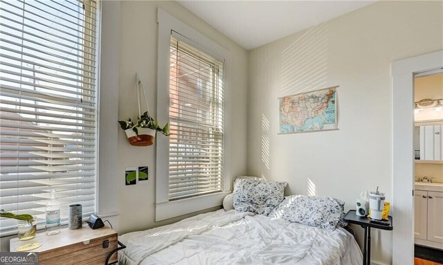 1313 Whitaker St, Savannah, GA 31401 - bedroom with a sink and ensuite bathroom