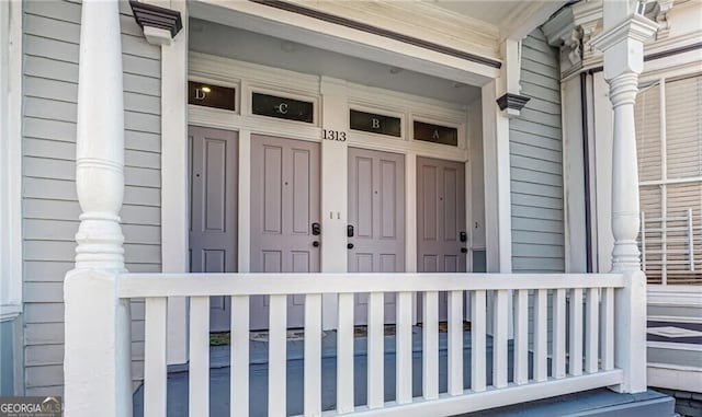 doorway to property featuring a porch