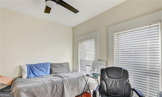 bedroom featuring hardwood / wood-style floors and ceiling fan