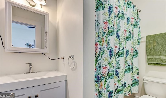 bathroom with vanity and toilet