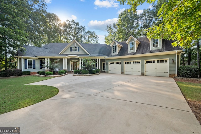 view of front of property with a front lawn and a garage