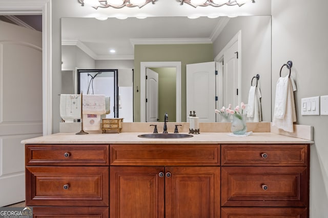 bathroom with vanity, ornamental molding, and walk in shower