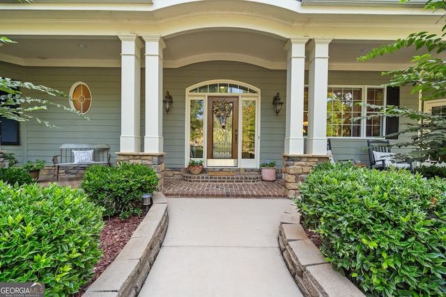 property entrance featuring covered porch