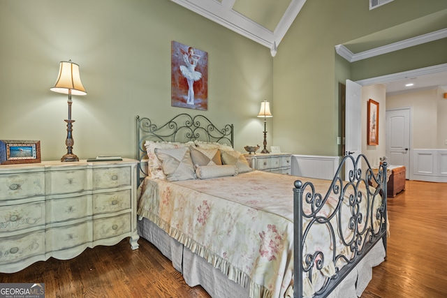 bedroom with crown molding and wood-type flooring