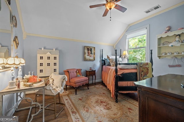 bedroom with ceiling fan, wood-type flooring, vaulted ceiling, and ornamental molding