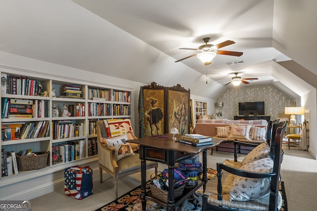 office space featuring lofted ceiling, carpet, and ceiling fan