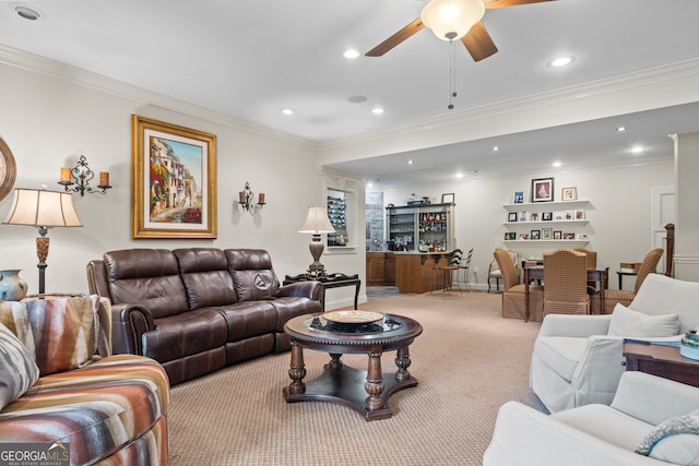 living room featuring carpet, crown molding, and ceiling fan