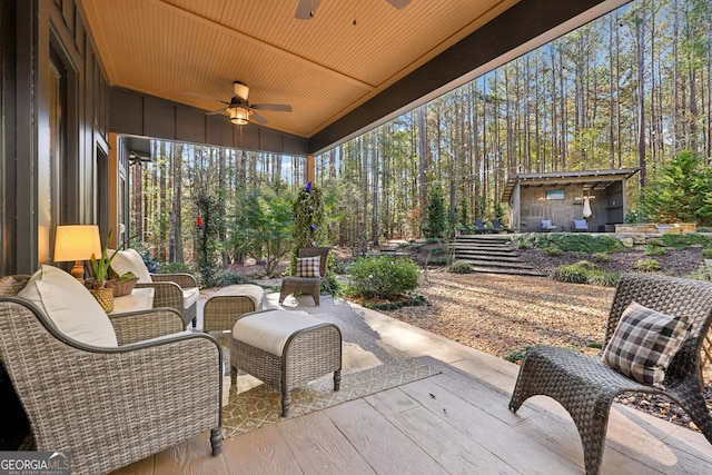 view of patio featuring ceiling fan and an outdoor living space