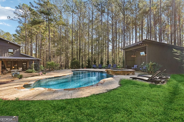 view of swimming pool with a patio area, an in ground hot tub, and a yard