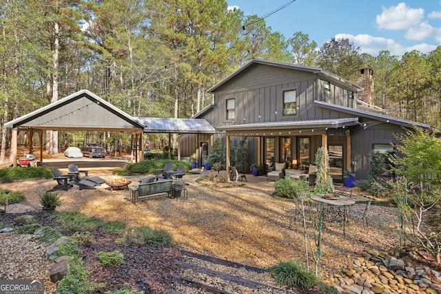 back of property with an outdoor hangout area