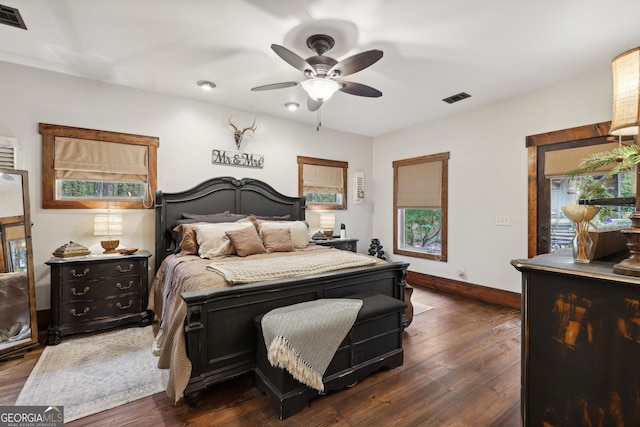 bedroom featuring ceiling fan and dark wood-type flooring