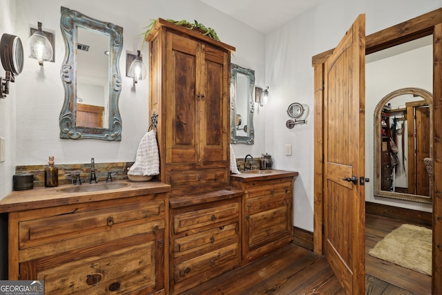 bathroom featuring vanity and wood-type flooring