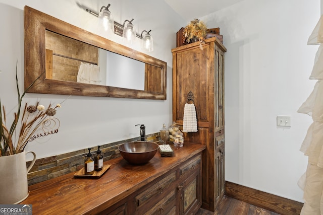 bathroom featuring hardwood / wood-style floors, vanity, and a shower with shower curtain