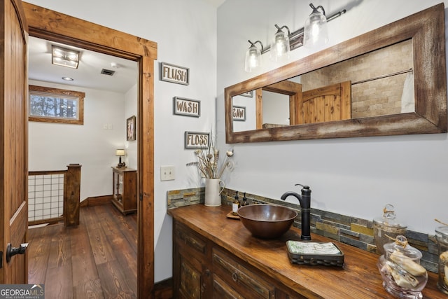 bathroom featuring vanity and wood-type flooring